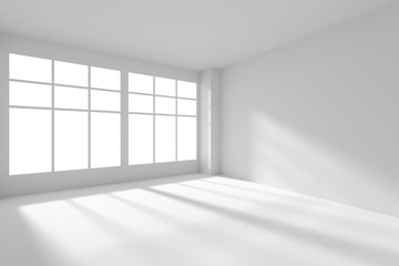 Empty white room with windows and sunlight