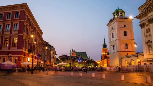 Warsaw, Poland. Walking by the empty Palace square early in the evening. Illuminated historical buildings, shops, cafes and restaurants. Sunset time-lapse in Warsaw, Poland.