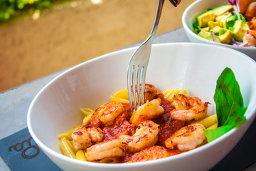 Italian pennes food dish with shrimps