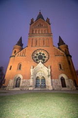 a night time shot of a church in Inowroclaw, Poland