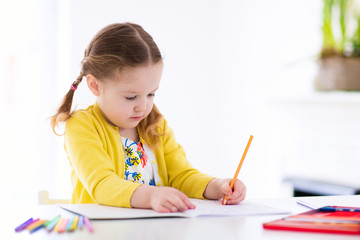 Kids read, write and paint. Child doing homework.