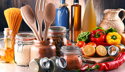 Composition with assorted food products and kitchen utensils