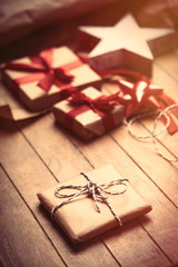 cute gifts, star shaped toy and things for wrapping on the wonderful wooden brown background