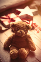 cute gift, star shaped toy, teddy bear and things for wrapping on the wonderful wooden brown background