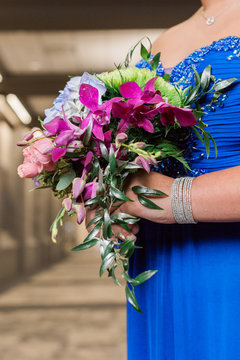 Teen girl holding prom floral bouquet