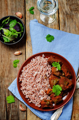 Beef slow cooker with red and white rice and green
