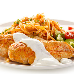 Fried chicken fillet, pasta and vegetables