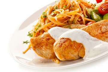 Fried chicken fillet, pasta and vegetables