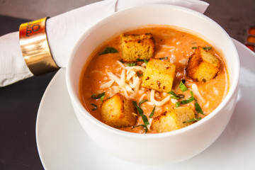 Cream of tomato with croutons and condiments