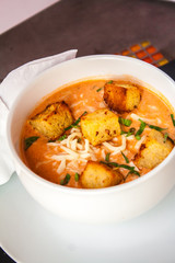 Cream of tomato with croutons and condiments