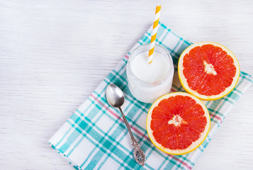 A healthy breakfast. Juicy grapefruit and homemade yogurt. Diet food. Detox and ease. Copy space.