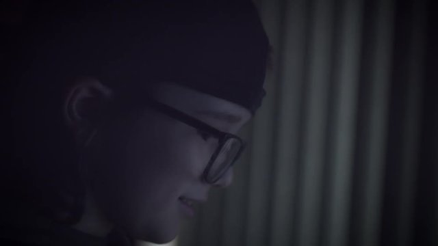 4K Close-up Child with Glasses Playing Video Game