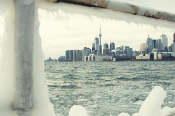Skyline of Toronto during winter season with ice in Lake Ontario