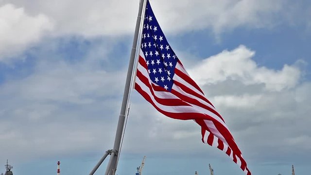 American flag of USS Missouri BB-63 warship at Pearl Harbor base in Honolulu Hawaii, Oahu island of United States. National historic and patriotic landmark.