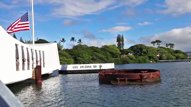Tourists visiting patriotic memorial monument shipwreck of USS Arizona BB 39 at Pearl Harbor in Honolulu Hawaii, Oahu island of United States. Sunken on December 7, 1941. National historic landmark.