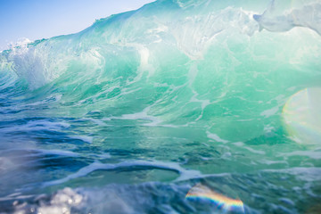 Fototapeta na wymiar Beautiful wave in ocean. Clear wave and sun light