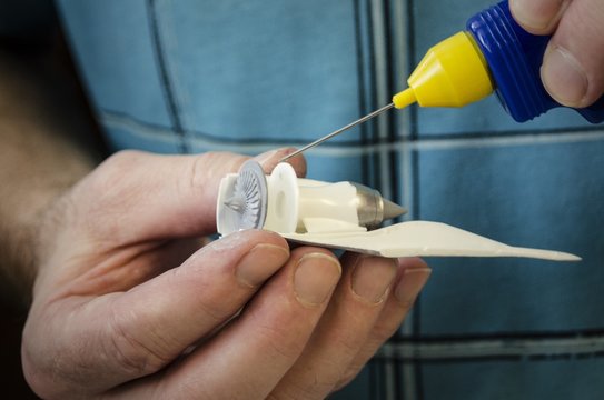 Glue some pieces of plastic model of big airplane