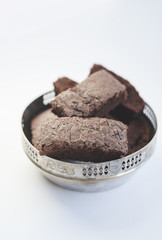 Chocolate brownies in a vintage silver bowl
