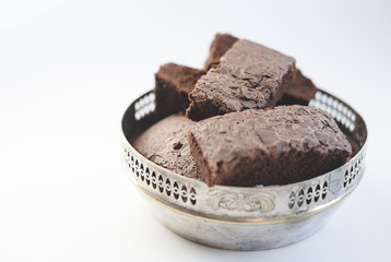 Chocolate brownies in a vintage silver bowl