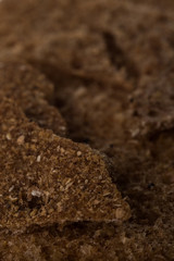Food background of broken rye crispbreads close