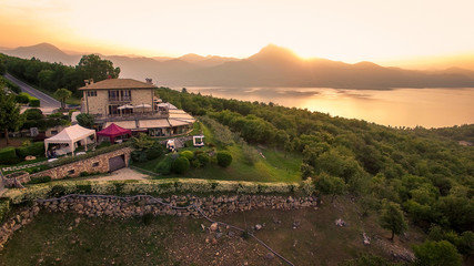 Fototapeta na wymiar Aerial view of the house of spirits, famous restaurant on Lake Garda, Italy.