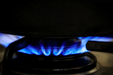 Gas Burner on Stove with Black Pot