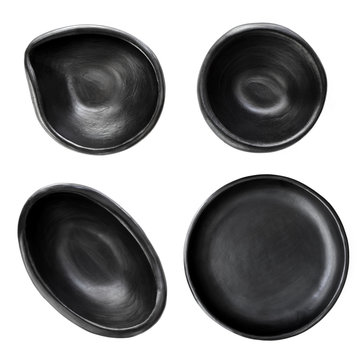 Collection of Empty Black Rustic Clay Plates Top View Isolated