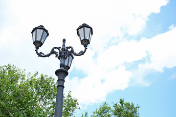 Street lamps on the sky background
