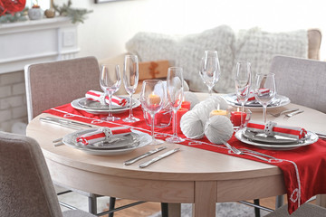 Table served for Christmas dinner in living room