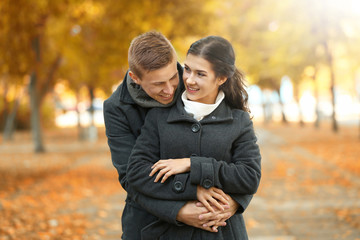 Beautiful young couple outdoors on sunny day