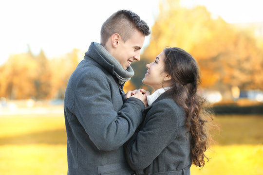 Beautiful young couple outdoors on sunny day