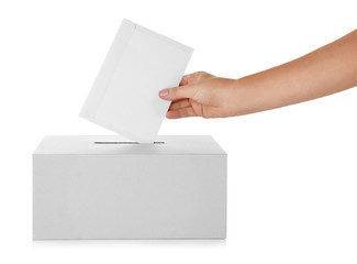 Female hand putting voting ballot into the box  on white background
