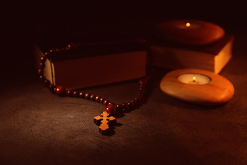 Bible with wooden cross, closeup