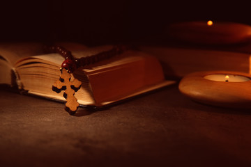 Bible with wooden cross, closeup