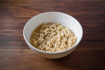 White Bowl of Japanese Ramen Noodles on Wooden Table
