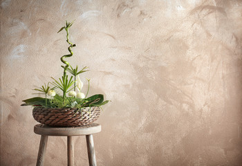 Flower arrangement on color background