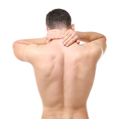 Handsome young man suffering from neck pain on white background