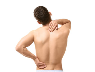 Young man suffering from backache on white background