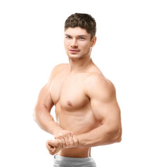 Fototapeta premium Handsome sporty man on white background
