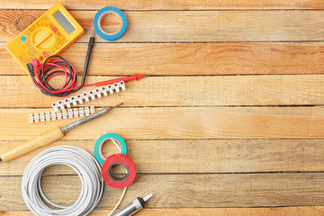 Different electrical tools on wooden table