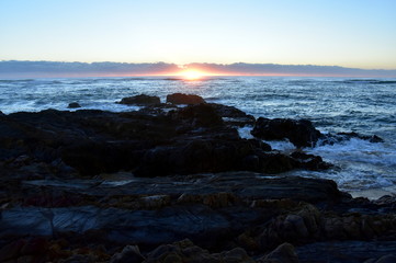 Fototapeta na wymiar Calm peaceful sea and beach on tropical sunrise. A beautiful january sunrise in Australia.