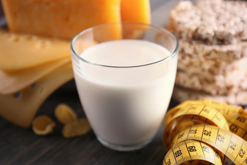 Different dairy products on wooden background