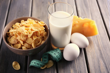 Different dairy products on wooden background