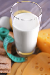 Different dairy products on wooden background
