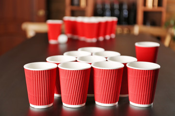 Game Beer Pong on wooden table
