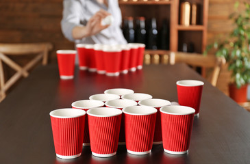 Game Beer Pong on wooden table