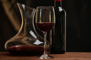 Glass of red wine on table