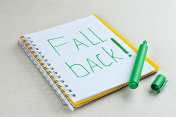 Phrase FALL BACK in notebook
