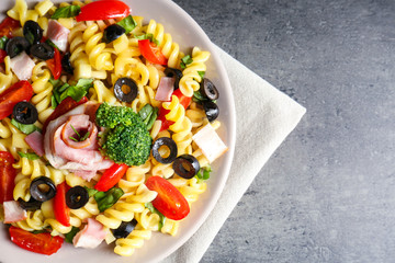 Cold pasta salad on table, closeup