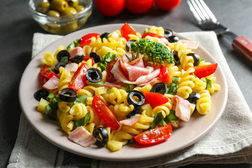 Cold pasta salad on table, closeup